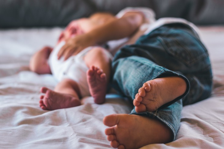 Parent and kid on the bed